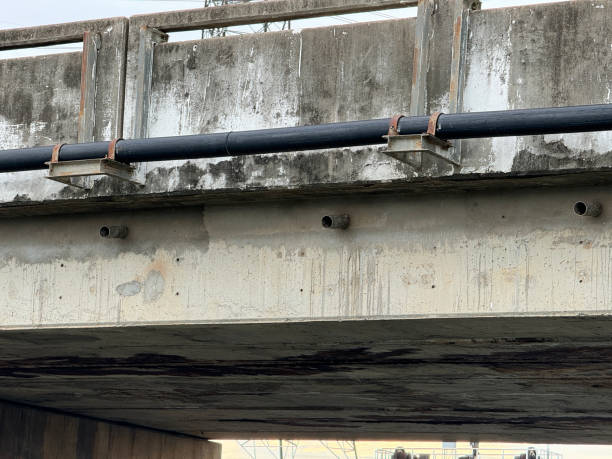 istock water tube on cement road bridge 2160434710