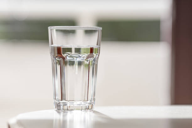 istock Glass of clean water under the bright light 2160435580