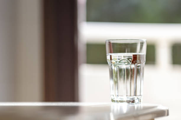 istock Glass of clean water under the bright light 2160435594