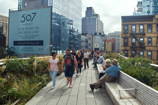 New York, NY, USA - October 14, 2017: People enjoying the High Line, a 2.33 km elevated linear park, greenway, and rail trail created on a former New York Central Railroad spur on the west side of Manhattan in New York City