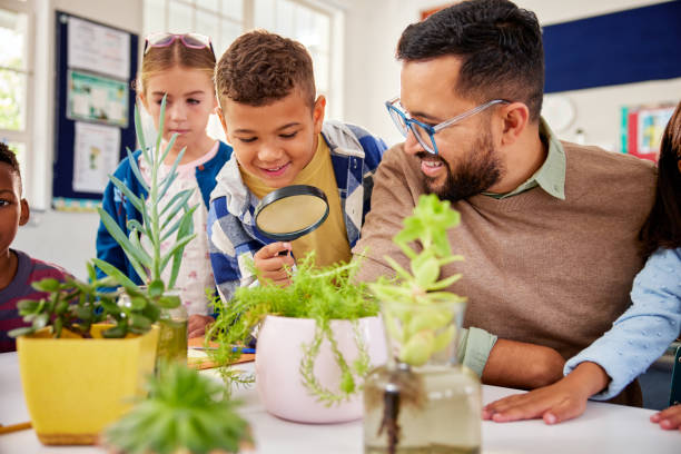 istock Children during science lesson learning about plant growth 2160438106