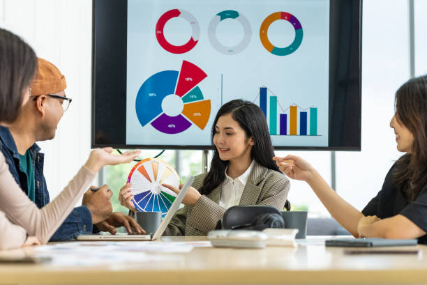 istock Happy diverse group Asian business start up freelance team analyzing statistics financial. Group Team of business people meeting conference discussion various topic corporate concept in office. 2160438904