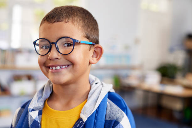 istock Happy smiling little boy looking at camera at primary school 2160439220