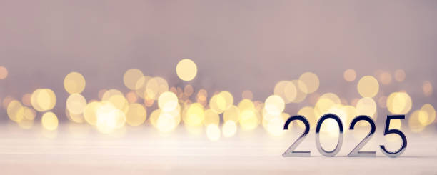 istock Metal numbers 2025 on table with bokeh lights. 2160441106
