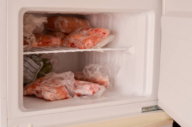 istock Freezer Filled with Frozen Meat 2160446779
