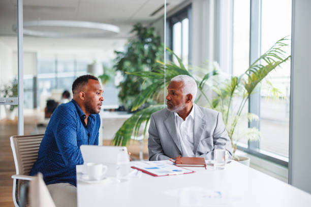 istock Business Colleagues in Discussion at Office 2160450347