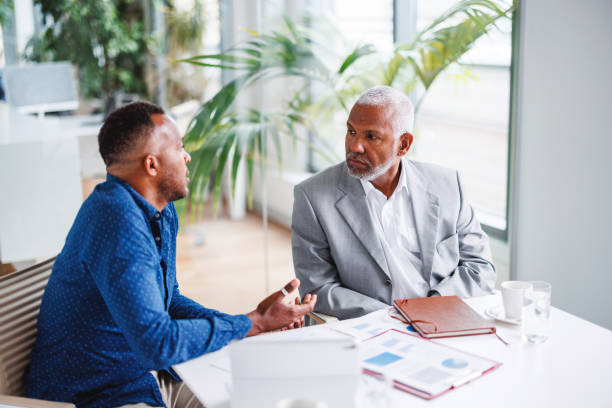 istock Focused Business Discussion Between Colleagues in Office 2160450399