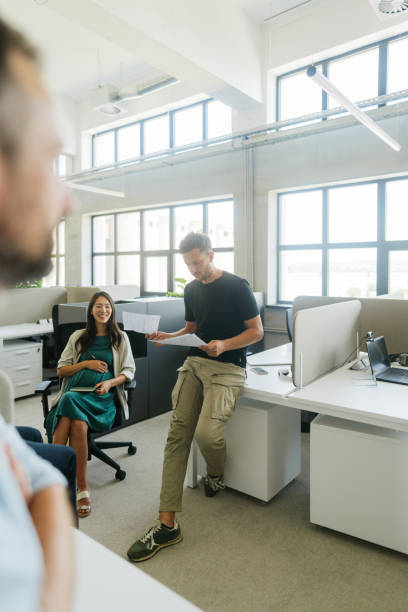 istock Coworkers discussing in the office 2160457540
