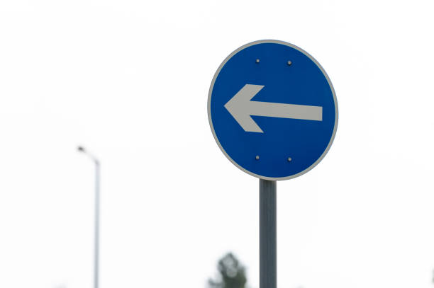 Direction to be followed traffic sign in summer.