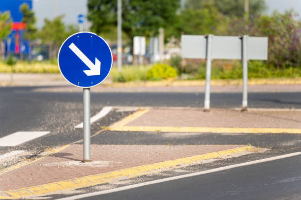 istock Keep right traffic sign with pedestrian crossing next to the roundabout 2160459165