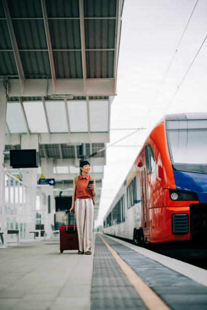 istock Woman uses the train to commute to work 2160462865