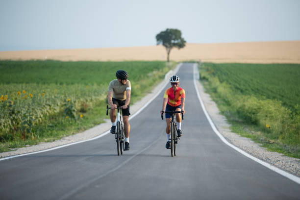 istock Couple enjoying road cycling together. 2160463812