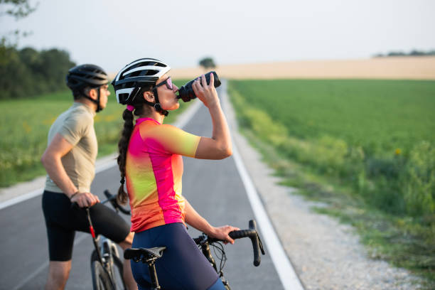 istock Having a refreshing sip of water during cycling exercise. 2160463820