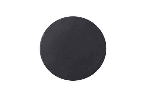 istock Empty round slate plate for template on the black background 2160466793