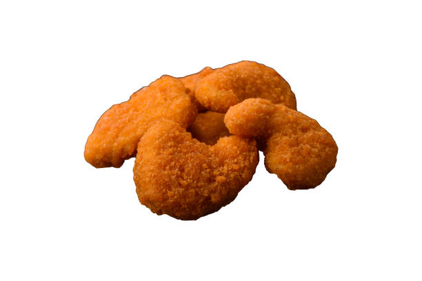 istock Delicious fresh crispy chicken nuggets on a dark concrete background 2160467151