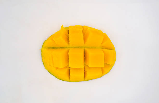 Delicious Looking Green Mangoes Chopped Tropical Fruit Cut Slices and Whole in a Basket Isolated White Background