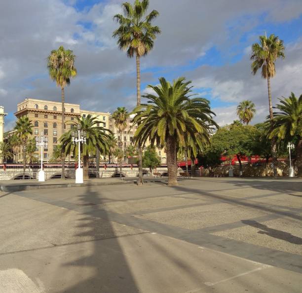 istock Square in Barcelona, ​​palm trees and benches for rest 2160467830