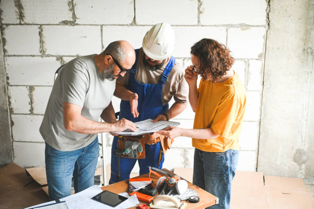 istock workers are doing repairs in the apartment 2160470728