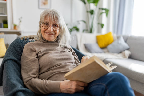 istock Senior Woman Reading a Book 2160472626