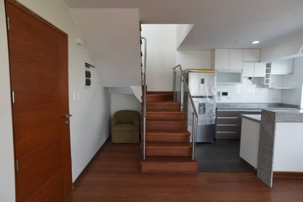 istock Duplex apartment staircase with wood finishes 2160474734