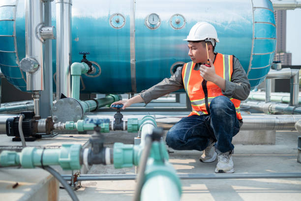 istock Industrial Engineer Communicating via Walkie-Talkie on Site 2160475928