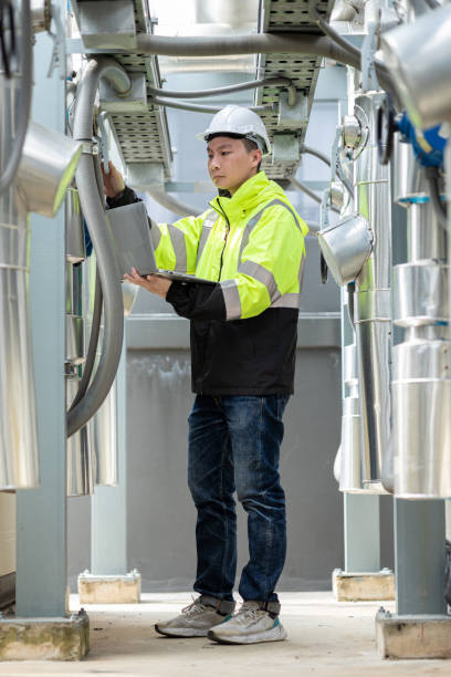 istock Engineer Inspecting Chilled Water Fan Coil Unit 2160475934