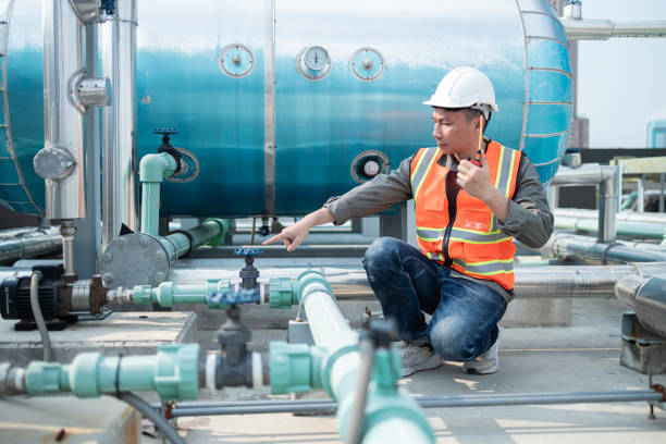 istock Industrial Engineer Communicating via Walkie-Talkie on Site 2160475942