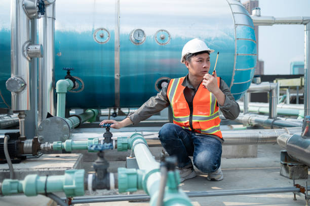istock Industrial Engineer Communicating via Walkie-Talkie on Site 2160475943