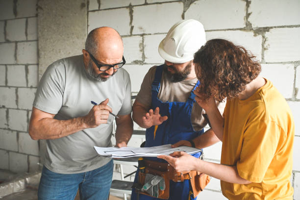 istock workers are doing repairs in the apartment 2160478191