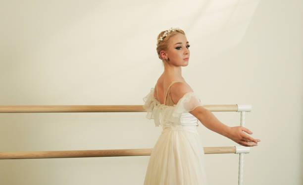 istock Reflective Ballet Dancer at Barre in Minimalist Studio 2160478993