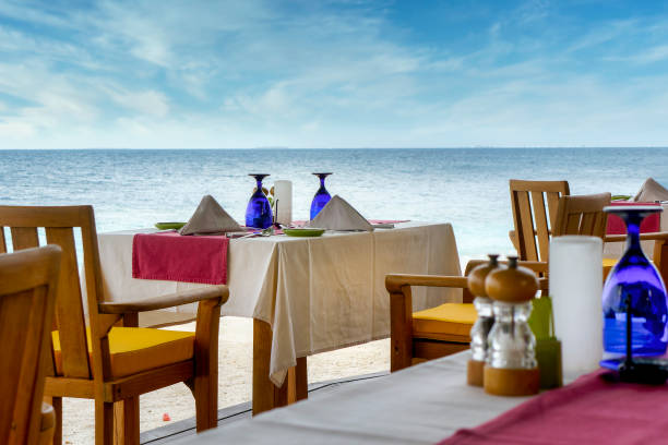 istock Romantic table setting in tropical restaurant on the beach 2160479004