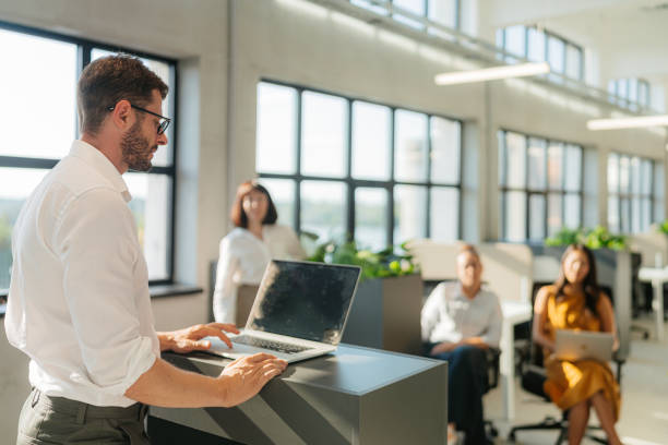 istock A man leading the meeting with his presentation 2160480482