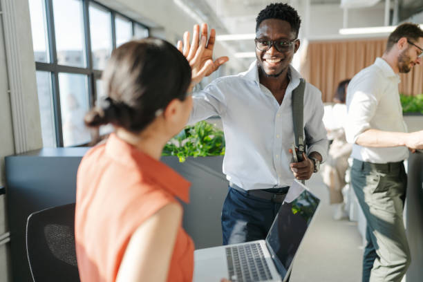 istock Group of diverse people working in a co-working office space 2160480491