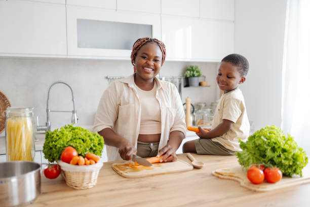 istock Black family Having Fun in the Kitchen 2160481221
