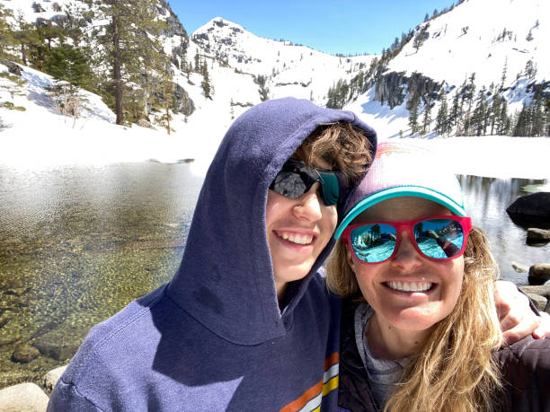 Mother and son selfies on mountain hike
