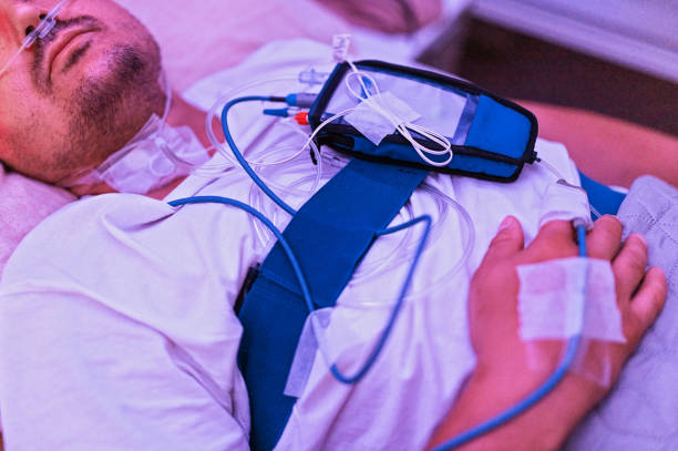 Doctor in a mask carefully handling a medical tool, preparing for a patients treatment