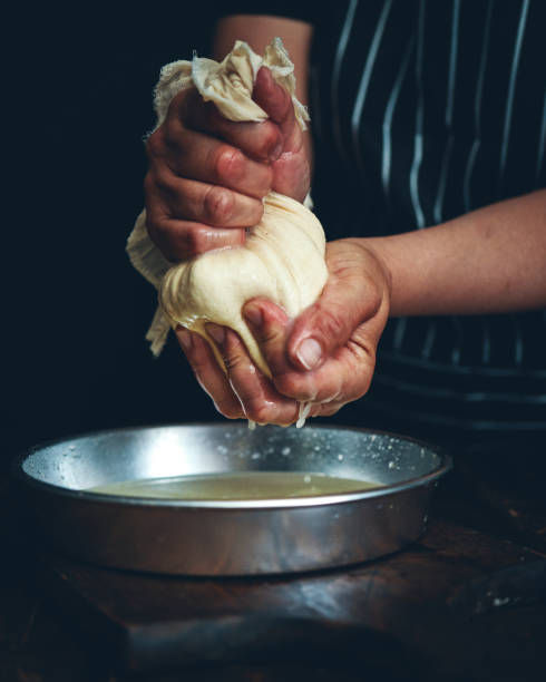 istock Making Fresh White Cheese in Domestic Kitchen 2160485773