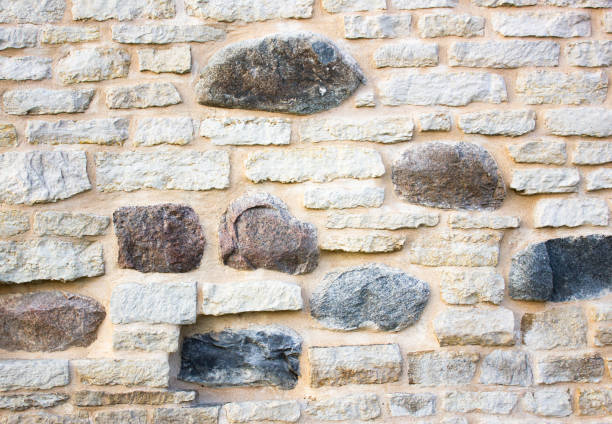 Rough uneven stone wall forming a textured architectural background