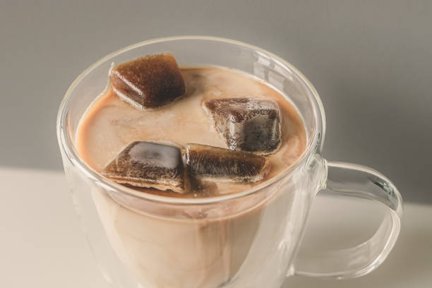 istock Frozen coffee cubes filled with milk in a glass cup 2160490156
