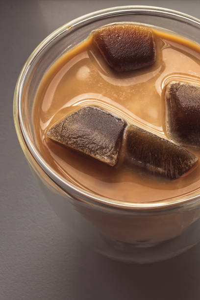 istock Frozen coffee cubes filled with milk in a glass cup 2160490166