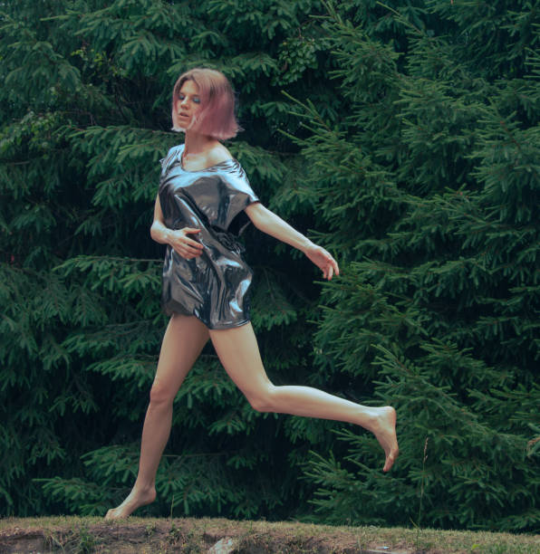 istock young beautiful woman in action at nature 2160492086
