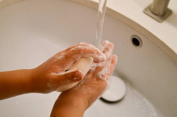 istock Washing Hands with Soap Under Tap, children hygiene. 2160492265