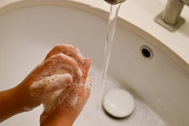 istock Washing Hands with Soap Under Tap, children hygiene. 2160492271