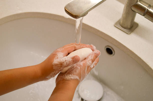 istock Washing Hands with Soap Under Tap, children hygiene. 2160492291