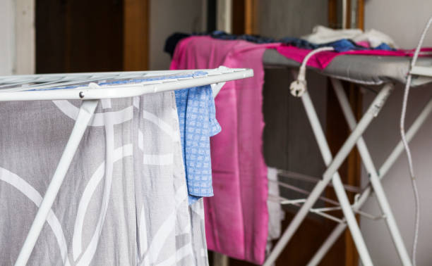istock ironing board and laundry in the messy home 2160492598