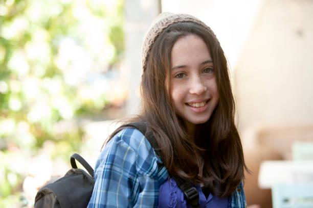 istock Back to school girl smiling with books and backpack 2160493507