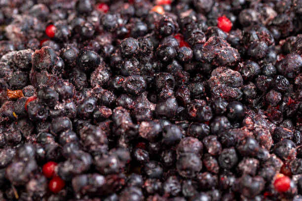 istock various blueberries after freezing are on the table 2160493822