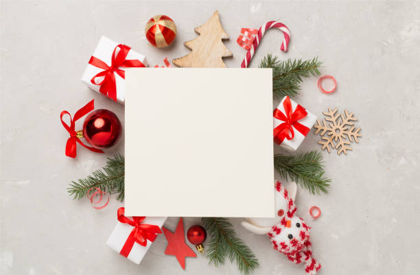 istock Greeting card mockup with christmas decor on concrete background, top view 2160496699