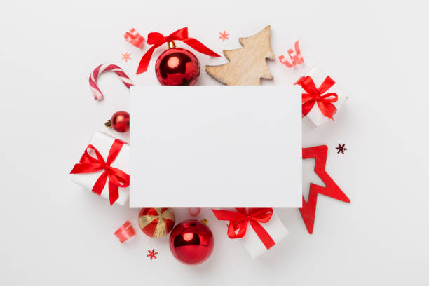 istock Greeting card mockup with christmas decor on color background, top view 2160496706