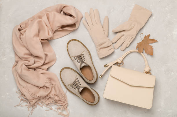 istock Stylish autumn accessories on concrete background, top view 2160497162